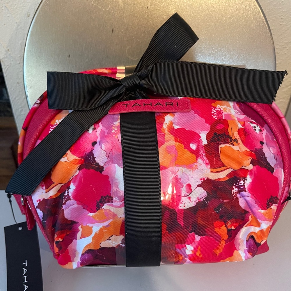NWT - Tahari 2 piece floral
Dome bags cosmetics set.  NWT